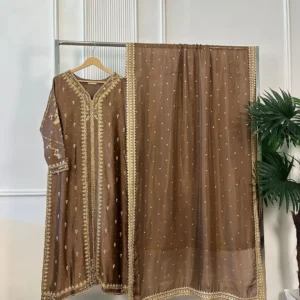 Full view of 3-piece brown Pakistani bridal suit with gold embroidered kurti and pearl dot dupatta on clothing rack